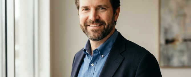 Confident professional man with natural hairline showing successful hair restoration men results