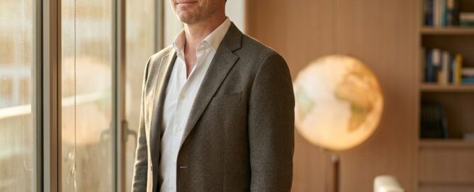 Confident man in modern consultation office representing hair restoration international patient services journey