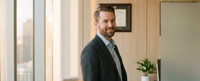 Confident man in modern consultation office representing the FUE hair transplant method patient journey
