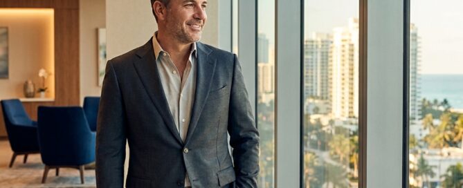 Confident man with natural-looking hair overlooking Boca Raton skyline, representing FUE hair transplant results.