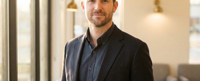 Confident man representing successful hair loss treatment results in a modern medical setting