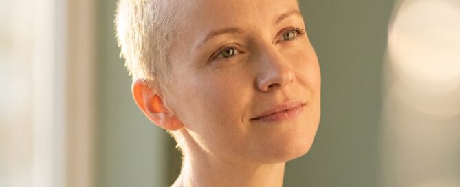 Woman with soft new hair regrowth symbolizing chemotherapy recovery and hair loss regrowth timeline options